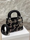 Lady Dior small black silk embroidery bag with silver hardware